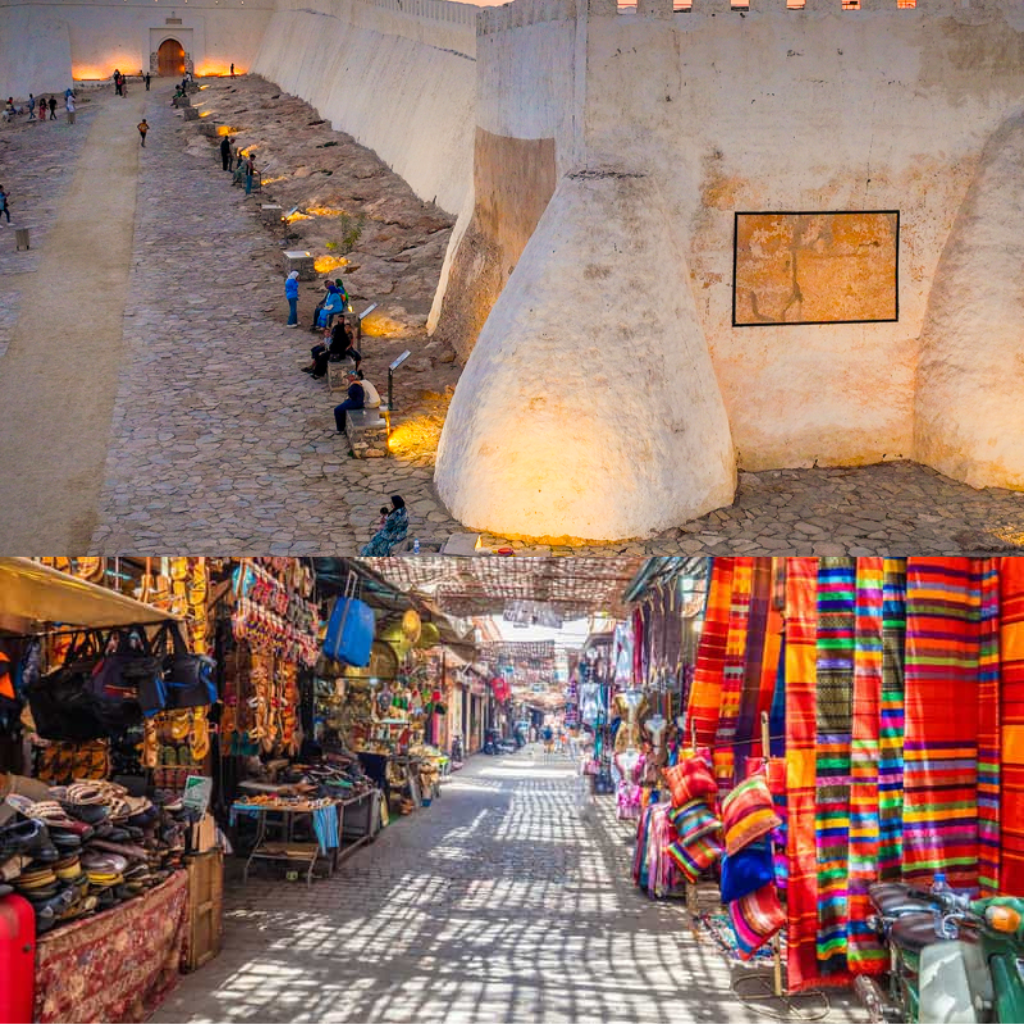 View of a historic fort with a market street featuring colorful textiles and goods.